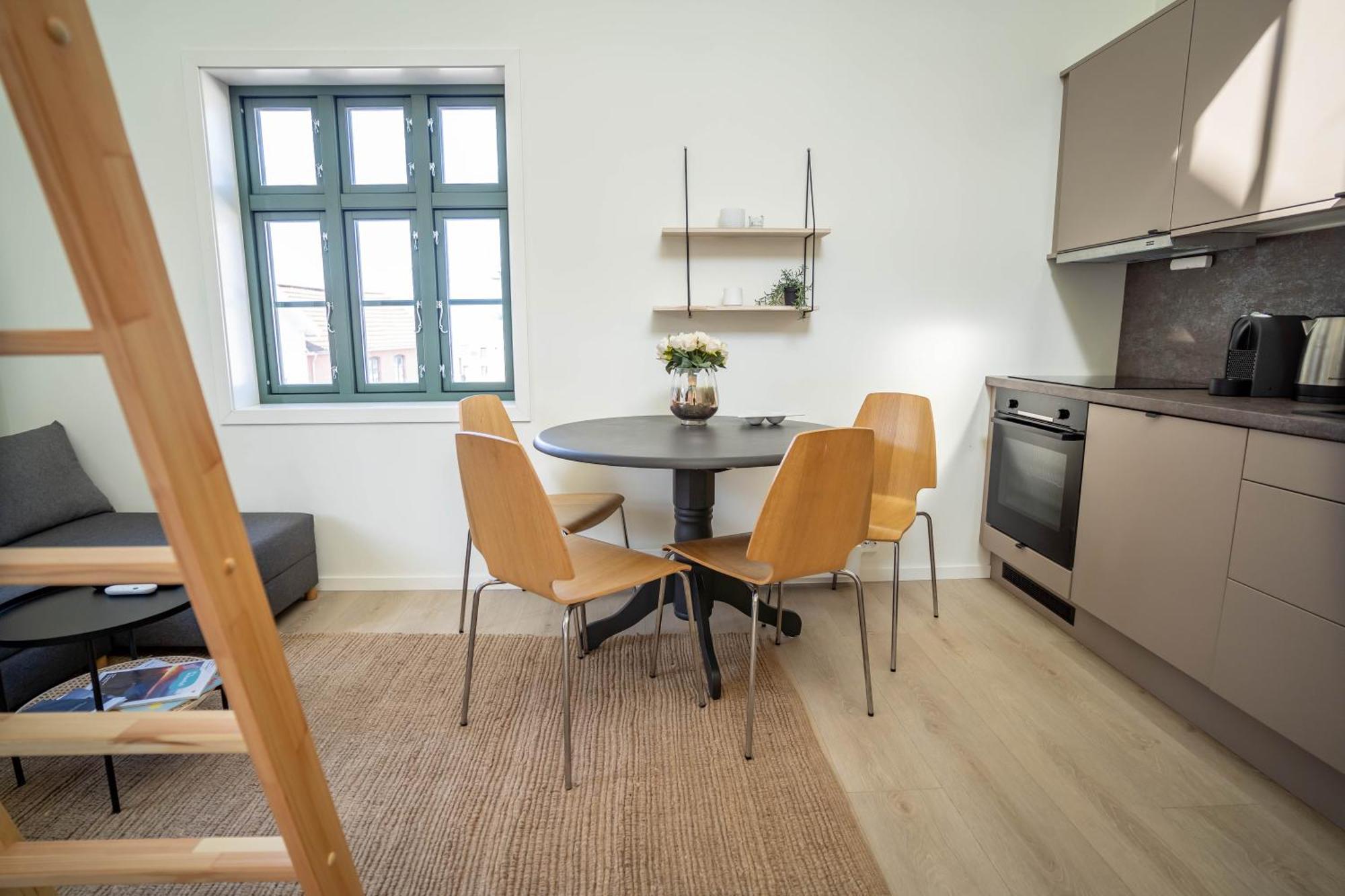 Vibrant On Bustling Street, Above A Restaurant Perfect For Tourists,